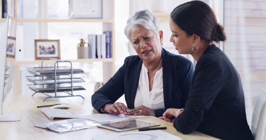 Woman talking to an employment lawyer about whistleblowing