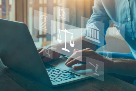 Guy on a laptop researching for attorney