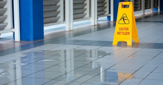 wet floor with caution sign