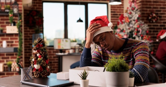sad man at work during Christmas