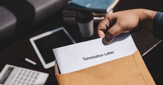employee looking at termination letter